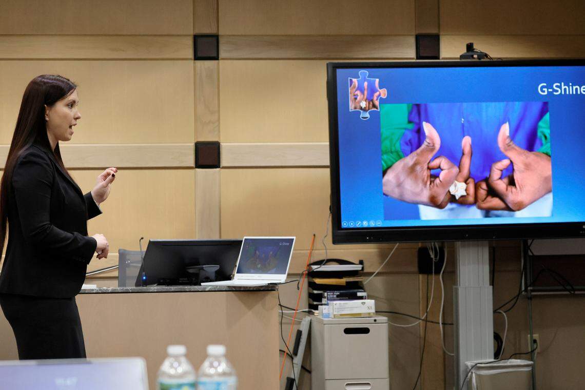 Asst. State Attorney Kristine Bradley shows a photograph of an alleged gang sign as she gives her closing argument in the trial of Jamell Demons, better known as rapper YNW Melly, at the Broward County Courthouse in Fort Lauderdale on Thursday, July 20, 2023. Demons, 22, is accused of killing two fellow rappers and conspiring to make it look like a drive-by shooting in October 2018. (Amy Beth Bennett / South Florida Sun Sentinel)