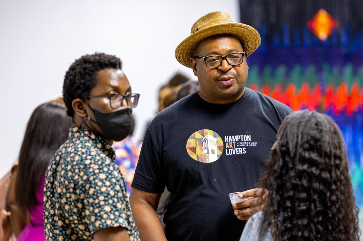 Christopher Norwood socializes during the Preview for The Art of Transformation event at The ARC and Logan Building in Opa-locka, Florida, on Wednesday, November 30, 2022. The event is a five-day, three-block Mecca of African and Haitian art fair coinciding with Art Basel Miami Beach 2022 and just one of over 40 ‘exhibits’ part of 2022 Art of Black Miami.