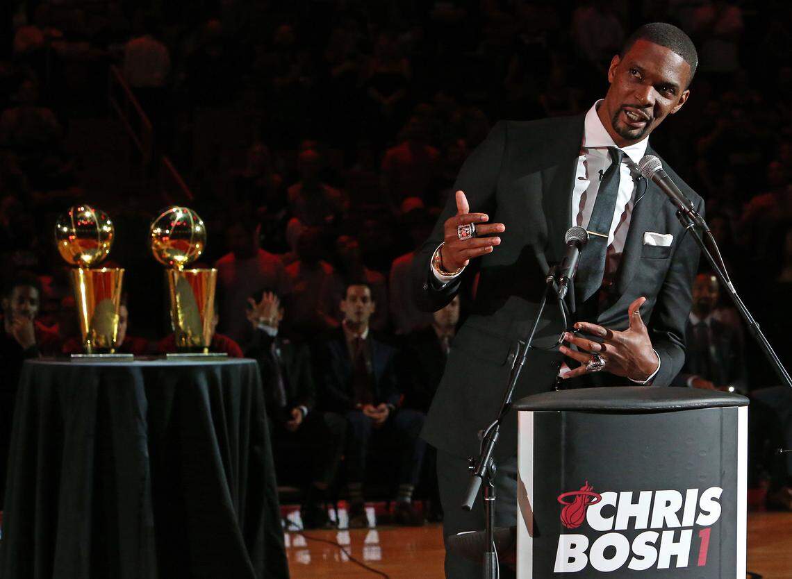 Former Miami Heat Chris Bosh speaks during a ceremony to retire his number at halftime of an NBA basketball game against the Orlando Magic at the AmericanAirlines Arena on Tuesday, March 26, 2019 in Miami.
