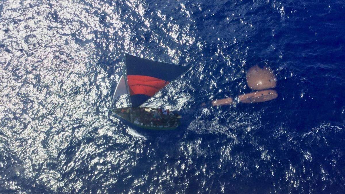 A group of 86 Haitians were returned to Haiti Saturday by the U.S. Coast Guard, the agency said, after a helicopter crew spotted an overloaded freighter 26 nautical miles north of Punta Maisi, Cuba.