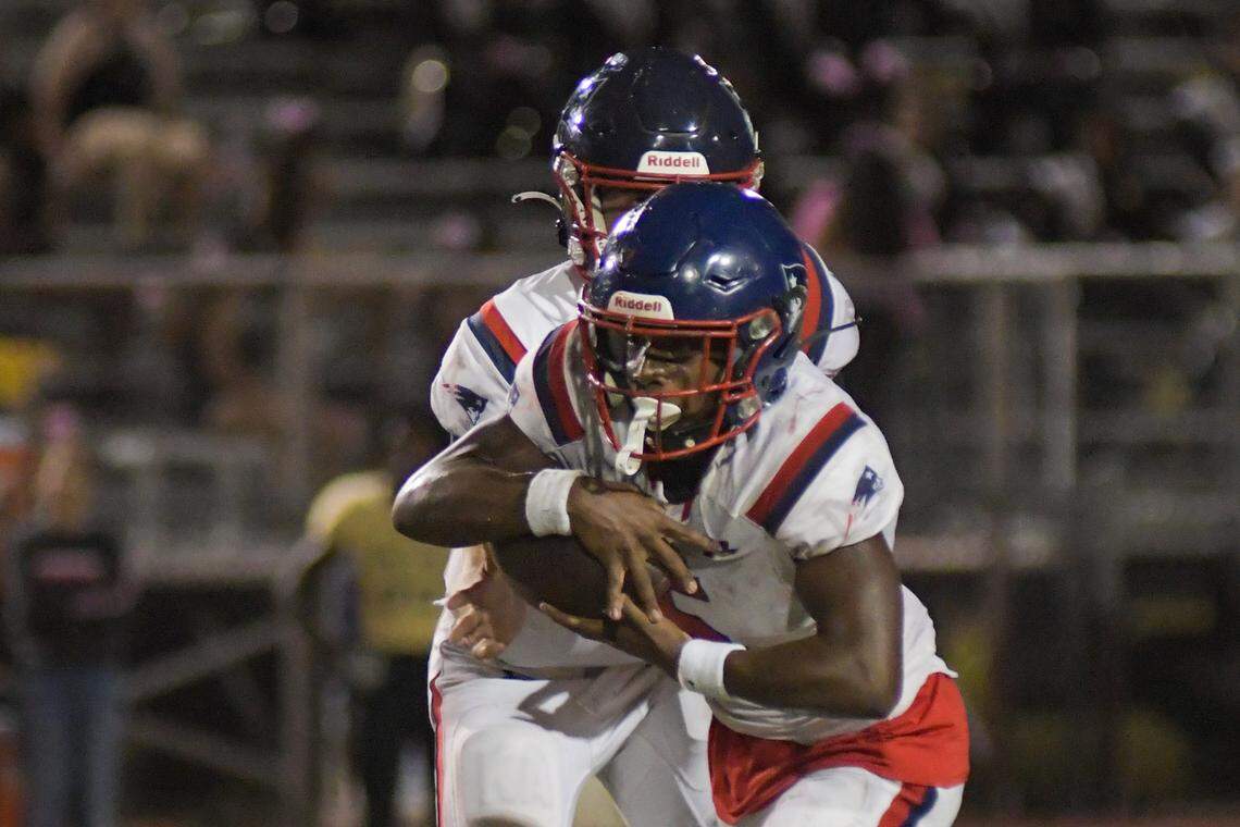 Miramar running back Nate Henry takes a handoff in a game against Western on Thursday, Oct. 20, 2022.