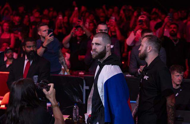 Jiří Procházka of Czechia makes his way toward the octagon before his light heavyweight title bout against Carlos Ulberg of New Zealand at UFC 327 at the Kaseya Center on Saturday, April 11, 2026, in downtown Miami, Fla.