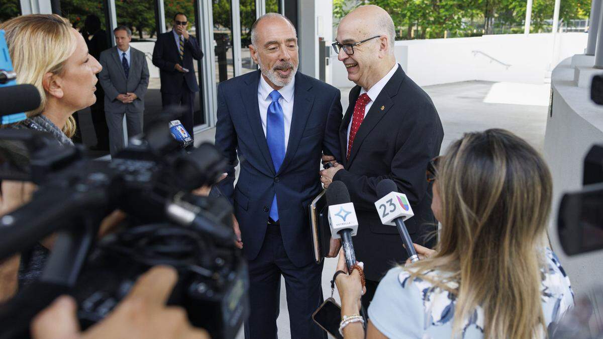 Emilio González, right, and his attorney Alan Lawson, center, hold a press conference after a hearing at the Third District Court of Appeal for a case Emilio González brought against the City of Miami on Tuesday, July 29, 2025, in Miami. A lower court judge ruled in favor of González, declaring the city's ordinance to be unlawful. The judge said changing the election date requires amending the City Charter, which requires voter approval. The city appealed the decision.