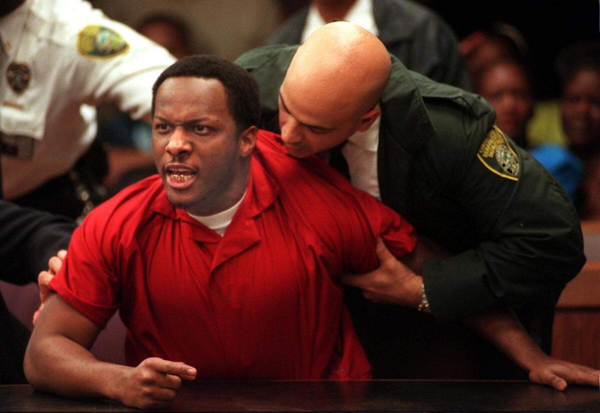 Labrant Dennis lost his temper and had to be restrained as he listened to Dekiesha Williams address the court in the slayings of Timwanika Lumpkins and Marlin Barnes. The judge sentenced Dennis to death.