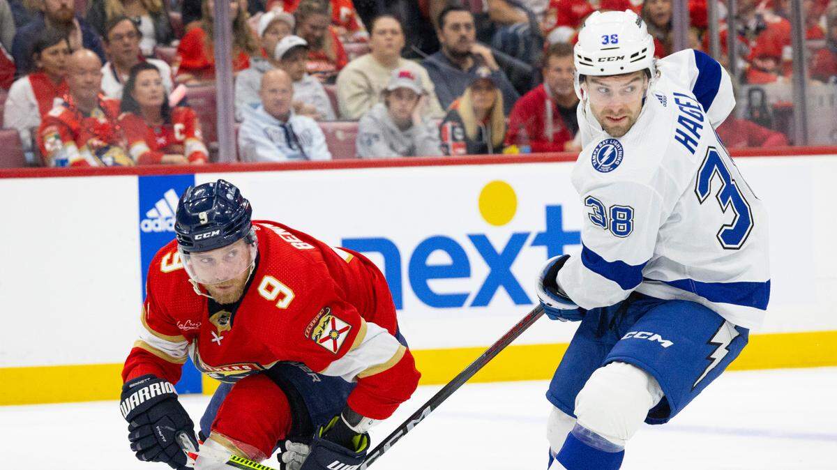 Florida Panthers center Sam Bennett (9) and Tampa Bay Lightning left wing Brandon Hagel (38) look for the puck during the second period of Game 1 of the Stanley Cup Playoffs Round 1 on Sunday, April 21, 2024, at Amerant Bank Arena in Sunrise, Fla. The score was 1-1 at the end of the second period.
