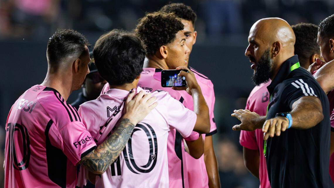 A field invader takes a selfie with Inter Miami forward Lionel Messi (10) after they scored their third goal against Philadelphia Union in the second half of their MLS match at Chase Stadium on Saturday, Aug. 24, 2024, in Fort Lauderdale, Fla.