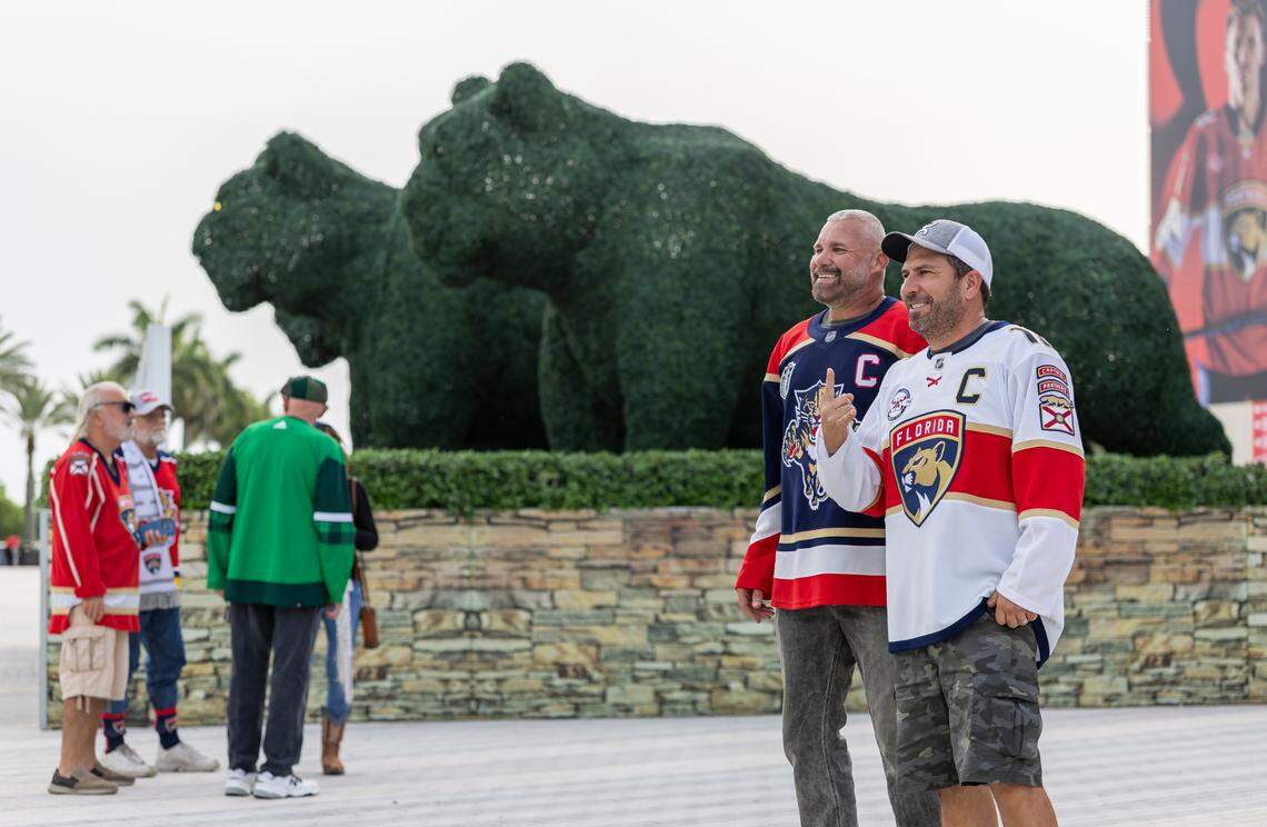 Florida Panthers fans Humberto Oliveira, left, and Matt Dealmeida, right, pose for a photo as they arrive to a watch party at the Amerant Bank Arena before his team plays against the Edmonton Oilers in Game 1 of the NHL Stanley Cup Final on Wednesday, June 4, 2025, in Sunrise, Fla.