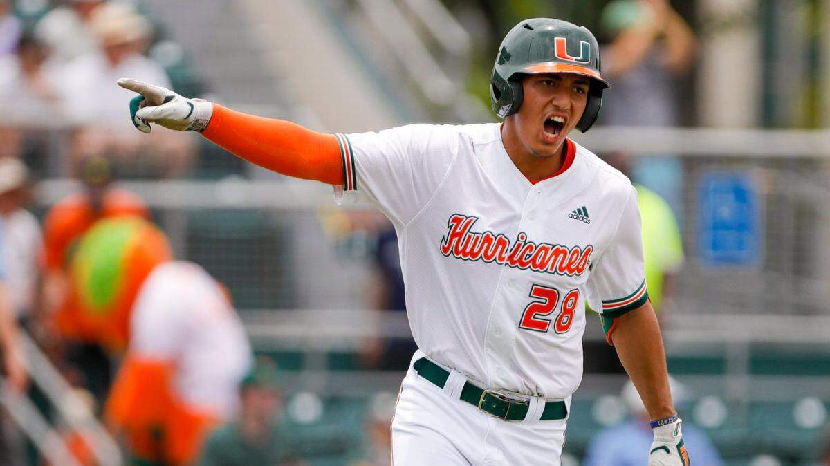 Miami Hurricanes infielder Ariel Garcia (28) signals toward the dugout after hitting a home run during the first inning against Notre Dame at Alex Rodriguez Park at Mark Light Field in Coral Gables, Florida on Saturday, May 21, 2022.