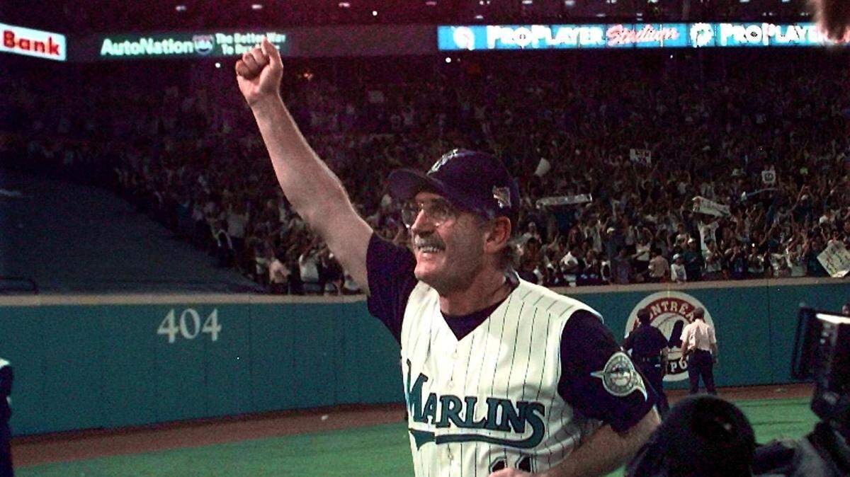 In this Oct. 26, 1997 file photo, Marlins manager Jim Leyland circles the field at Pro Player Stadium after winning the World Series.
