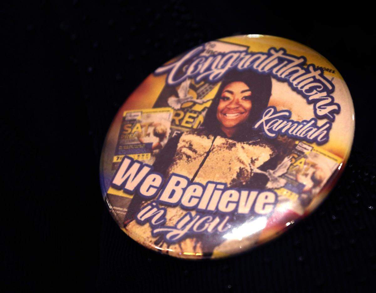 A supporter of Kamilah Campbell, a high school senior at Michael Krop High who has been accused by SAT officials of cheating because her scores jumped beyond the norm, wears a button stating her support for Campbell during her press conference at Miami News Net studios in Miami, Florida on Jan. 2, 2019.