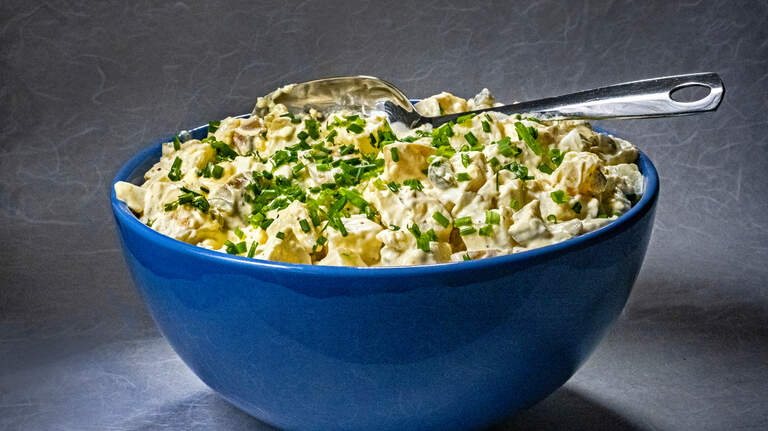 Potato salad is a perfect summer side and even better when made with crisp, garlicky pickles