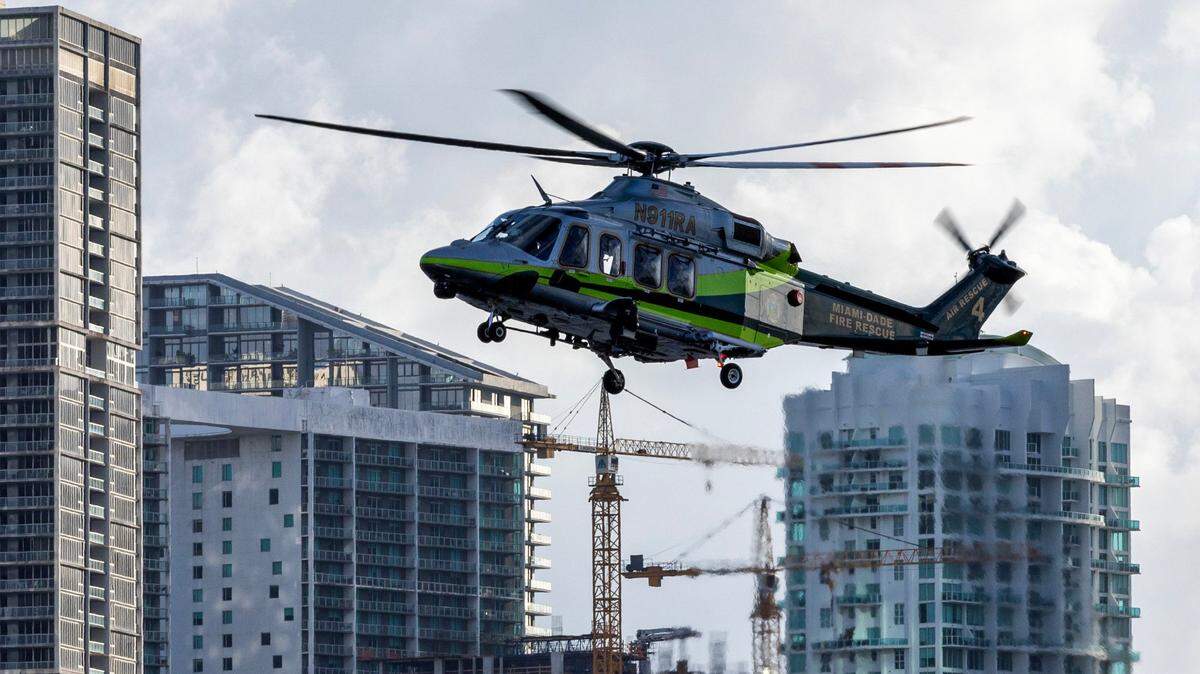 A Miami-Dade Fire-Rescue helicopter approaches a boat to perform a rescue during a South Florida Public Safety Regional Assets in Action Demonstration showcasing an active threat response incident in Biscayne Bay as part of the annual 2024 National Homeland Security Conference at PortMiami, Terminal J on Wednesday, July 24, 2024, in Miami, Fla.