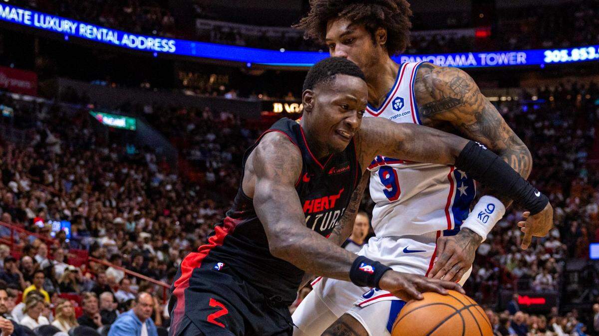 Miami Heat guard Terry Rozier (2) drives past Philadelphia 76ers guard Kelly Oubre Jr. (9) during the first half of an NBA game at Kaseya Center in Miami, Florida, on Thursday, April 4, 2024.