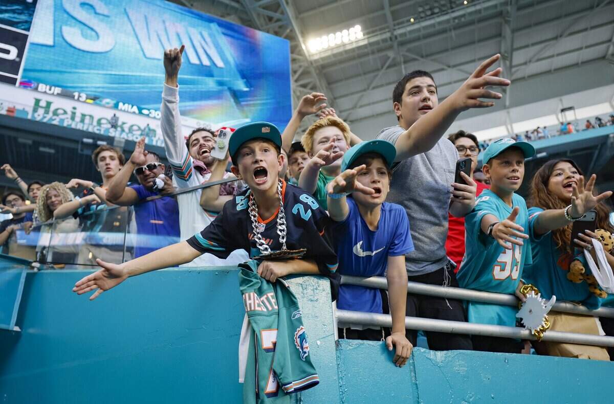 Miami Dolphins fans shjow their support after the Dolphins defeat the Buffalo Bills during an NFL football game at Hard Rock Stadium in Miami Gardens, Florida on Sunday, November 9, 2025.