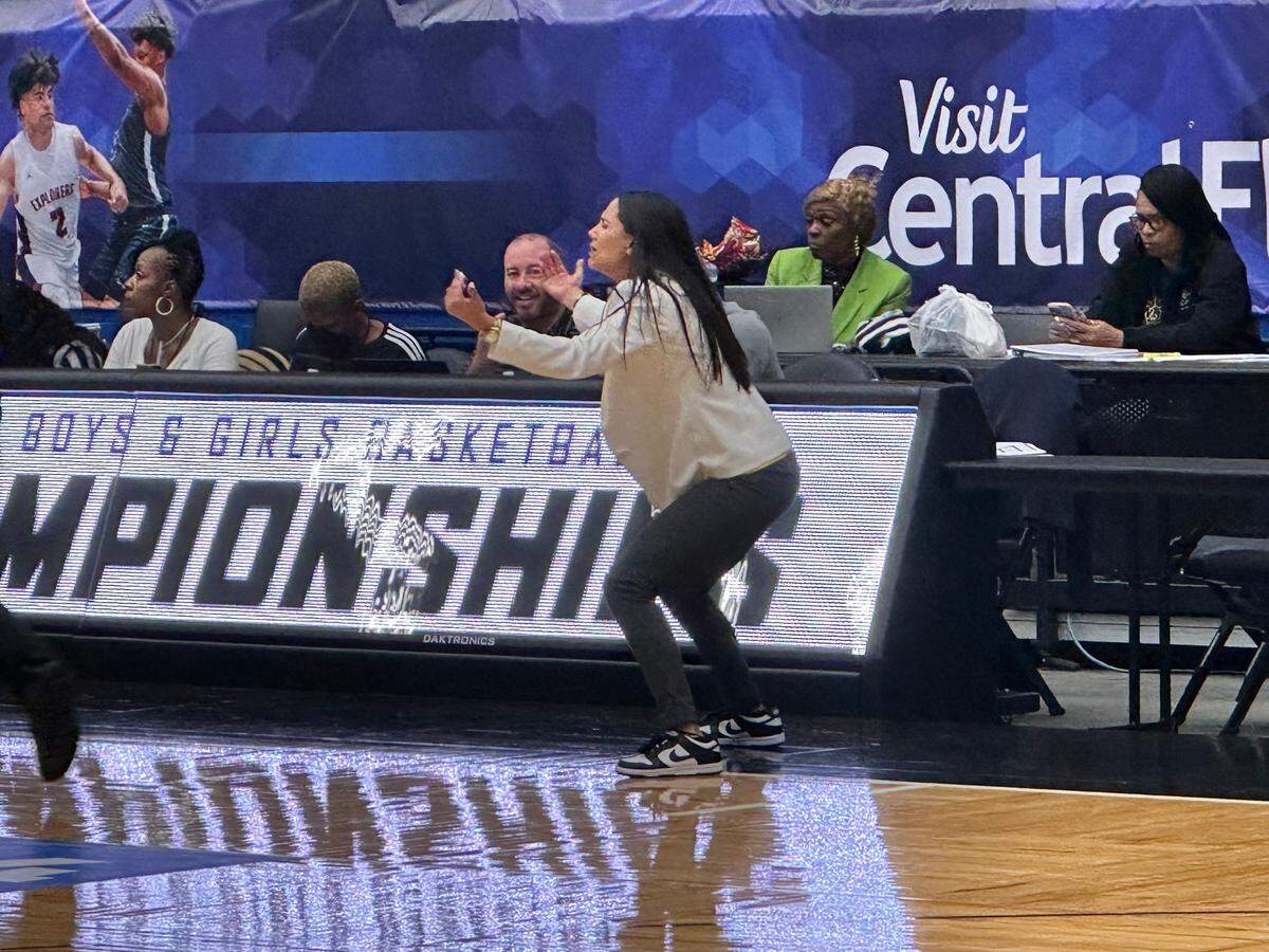 SLAM girls basketball coach Krystal Cabrera shouts instructions to her players from the sideline during Thursday’s Class 4A state semifinal against Jacksonville Bishop Kenny at the RP Funding Center in Lakeland, Fla.