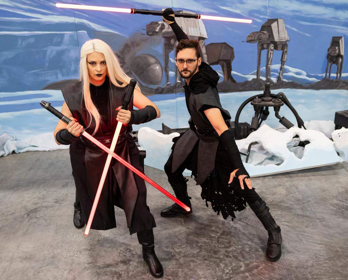 Victoria Decun, 31, as Darth Vek’tra and Eddy Ruiz, 30, as Darth Zaburas, cosplay as their original characters in the Star Wars universe during Florida Supercon 2024 at the Miami Beach Convention Center on Saturday, July 13, 2024, in Miami Beach, Fla.