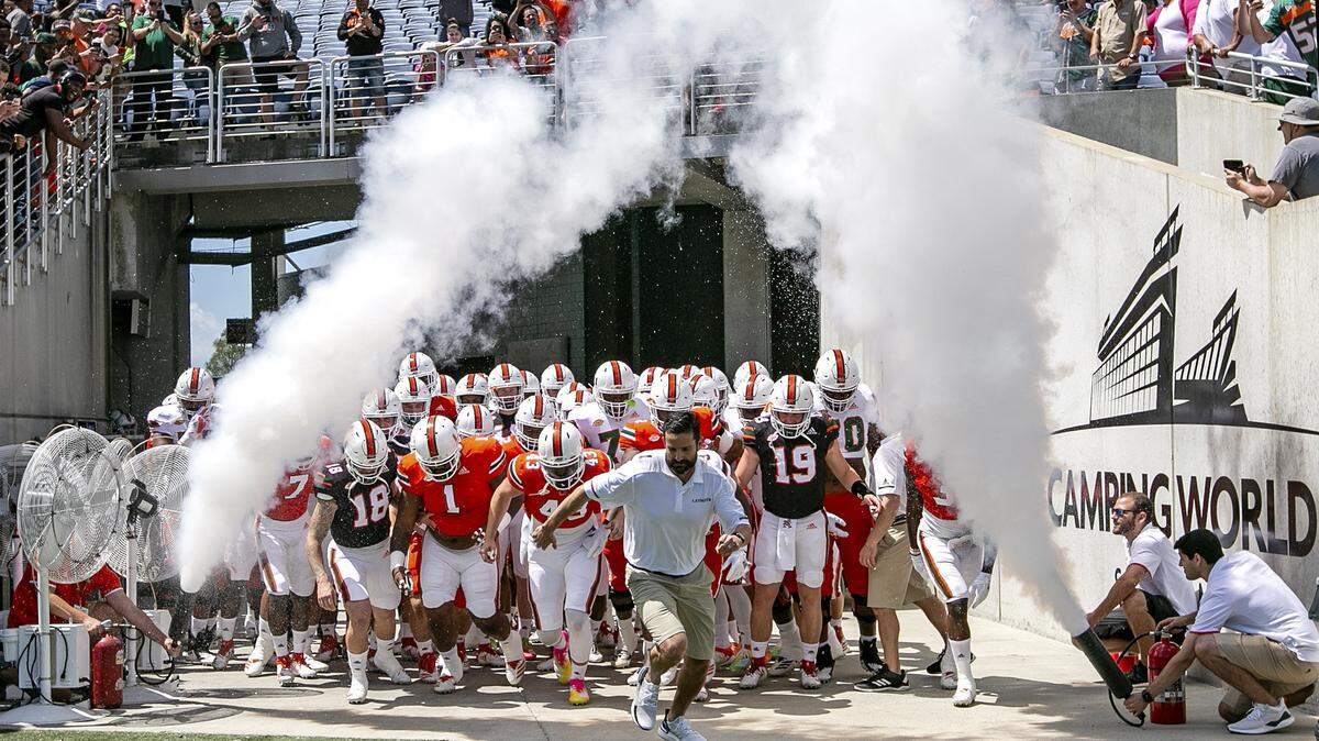Miami Hurricanes head coach Manny Diaz leads the team onto the field at the start of the Miami Hurricanes spring game at Camping World Stadium in Orlando on Saturday.