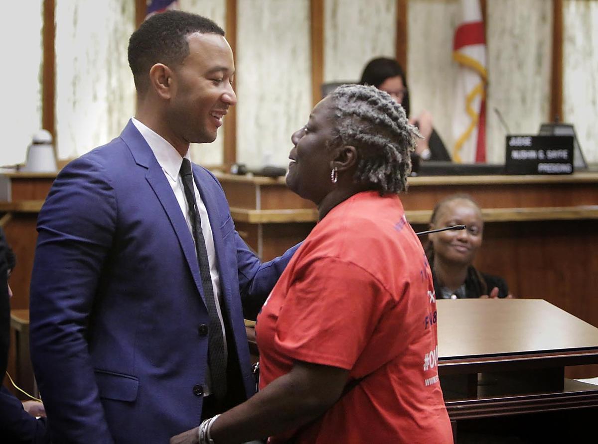 Singer John Legend, center, was on hand Friday at a special court hearing to restore the voting rights of former felons in Miami-Dade County.