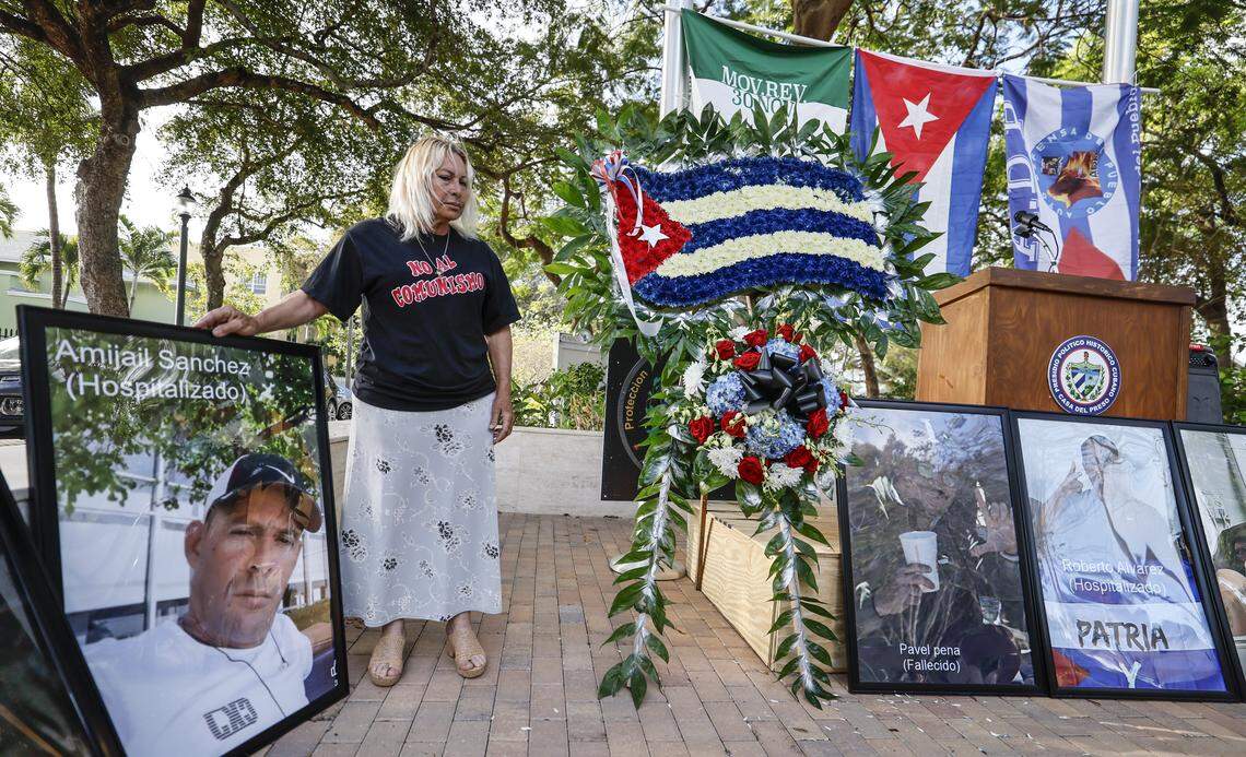Maritza Lugo Fernandez stands with a portrait Amijail Sanchez and others during a Proof of Life of Our Brothers ceremony at the Bay of Pigs Monument in the Little Havana area of Miami, Florida, on Sunday, March 8, 2026. Cuban dissident groups held a press conference to demand repatriation of the bodies of the men killed in the shootout with the Cuban Coast Guard on Sunday, March 8, 2026. They also demanded that the U.S. citizens involved in the incident be allowed to speak to U.S. diplomatic employees.