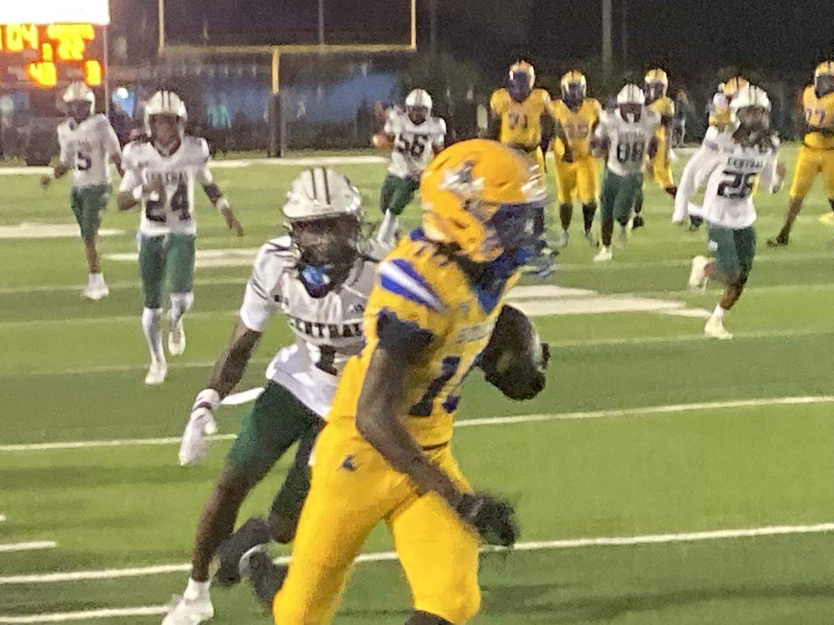 Northwestern wide receiver Marcus Dumont hauls in a touchdown pass from Neiman Lawrence on Saturday during the Bulls’ 50-29 win over Miami Central at Traz Powell Stadium in Miami, Fla.