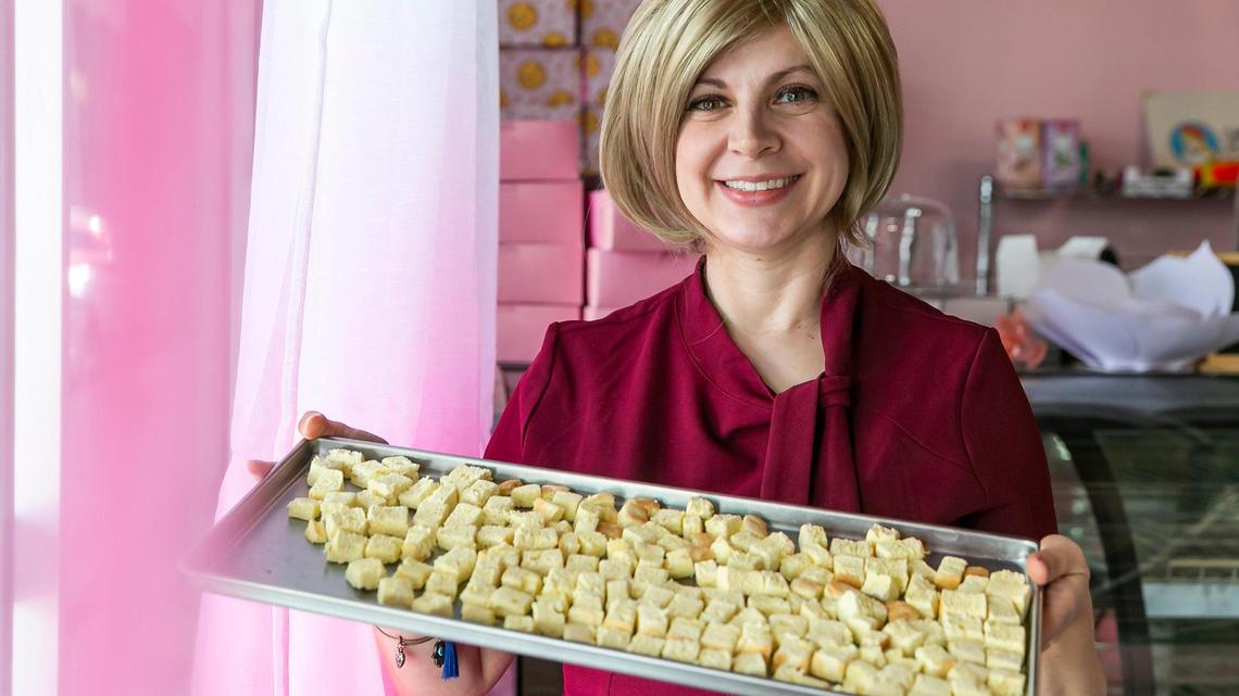 Jenifer Shwartz, 36, the creator of Freezcake, holds a tray of her freeze-dried cheesecake snack at her bakery in Hollywood, Florida, on Wednesday, April 27, 2022.