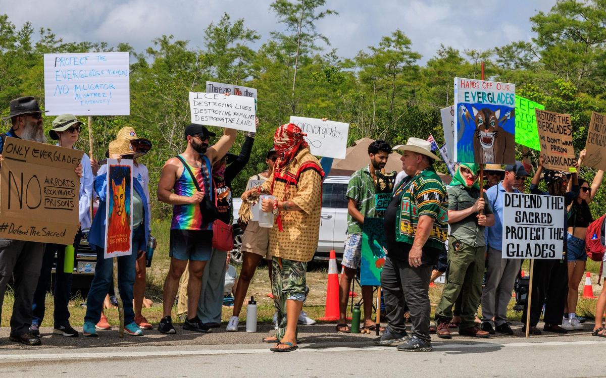 A tribe member blesses protesters outside of the Dade-Collier Training and Transition Airport during the “Stop Alligator Alcatraz” protest in opposition to the construction of a massive detention facility for undocumented immigrants on the site, which is in the middle of the Florida Everglades, in Ochopee, Florida, on Saturday June 28, 2025.