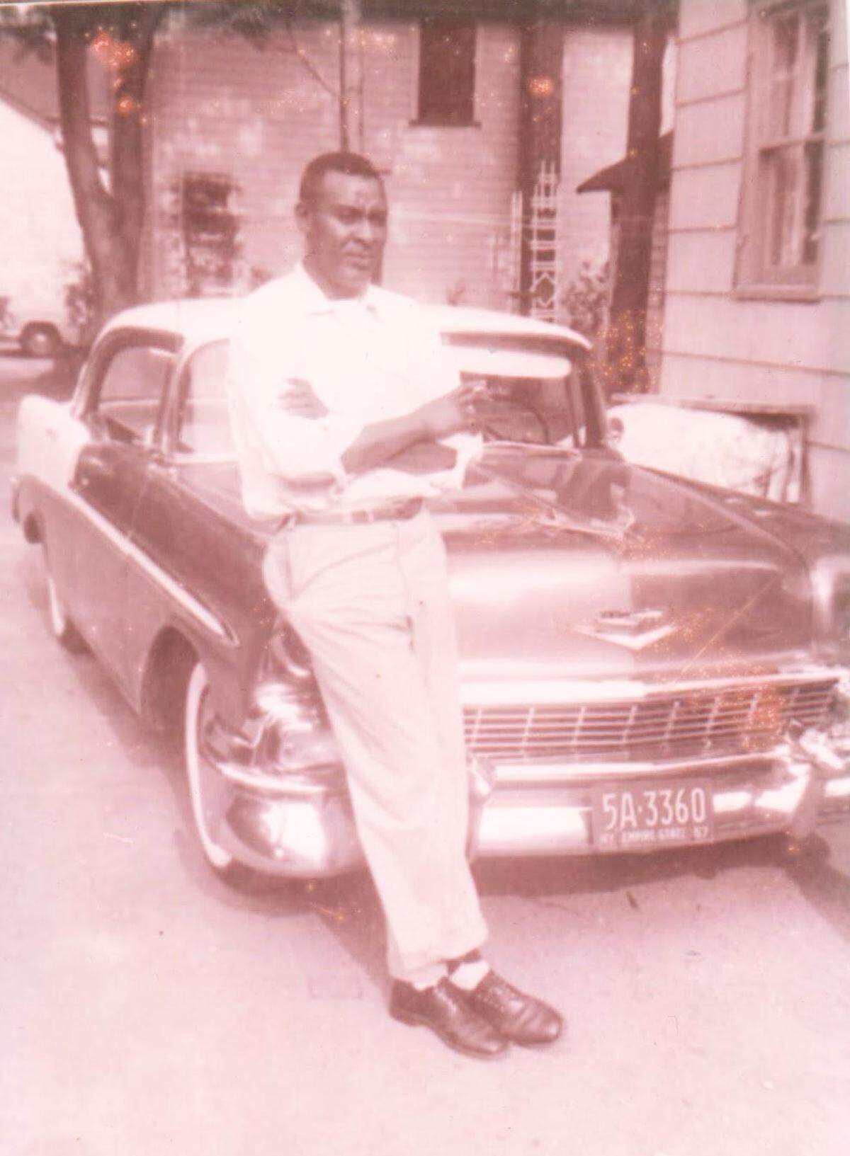 Moses Williams, a member of the Montford Point Marines, the first group of Black men who enlisted in the Marine Corps during World War II, leans against a car in this undated photo.