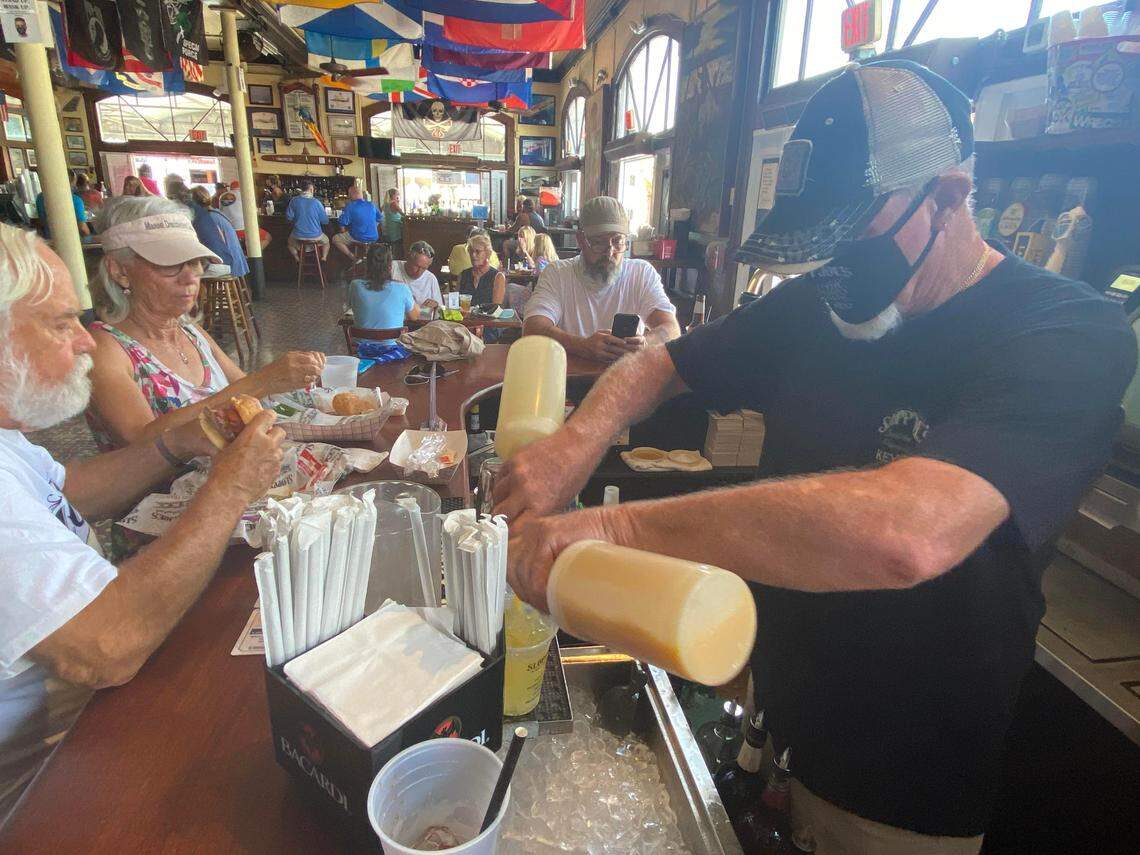 Lou Gammell tends bar at Sloppy Joe’s on its reopening day, Sept. 17, 2020. The bar shut down in March due to COVID-19.