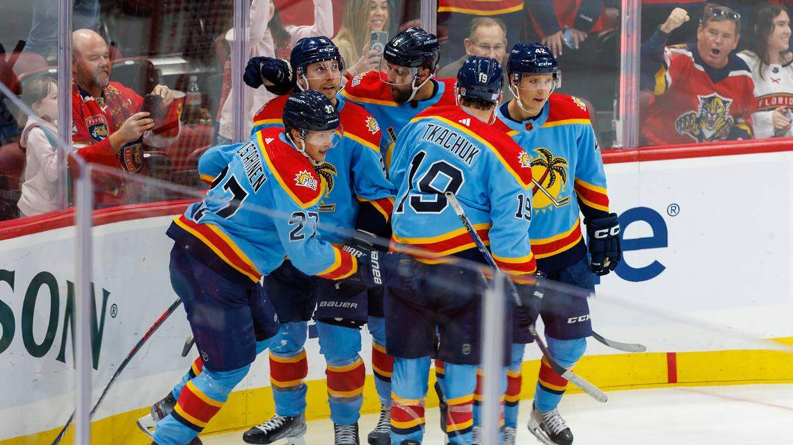 Florida Panthers center Eetu Luostarinen (27) celebrate with teammates after scoring a goal during the third period of an NHL game against the Calgary Flames at FLA Live Arena on Saturday, November 19, 2022 in Sunrise, Fl.