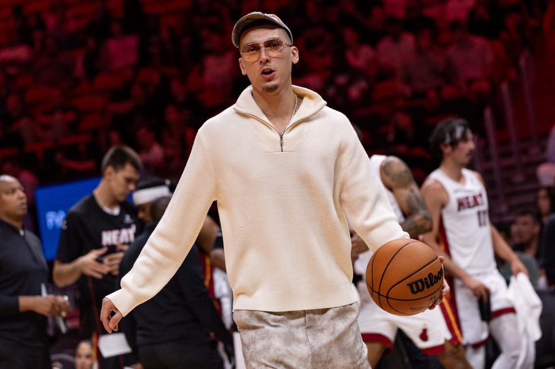 Miami Heat guard Tyler Herro (14) dribbles a ball on the sidelines during the first half of an NBA preseason game against the Milwaukee Bucks at Kaseya Center on Monday, October 6, 2025, in Miami, Fla.