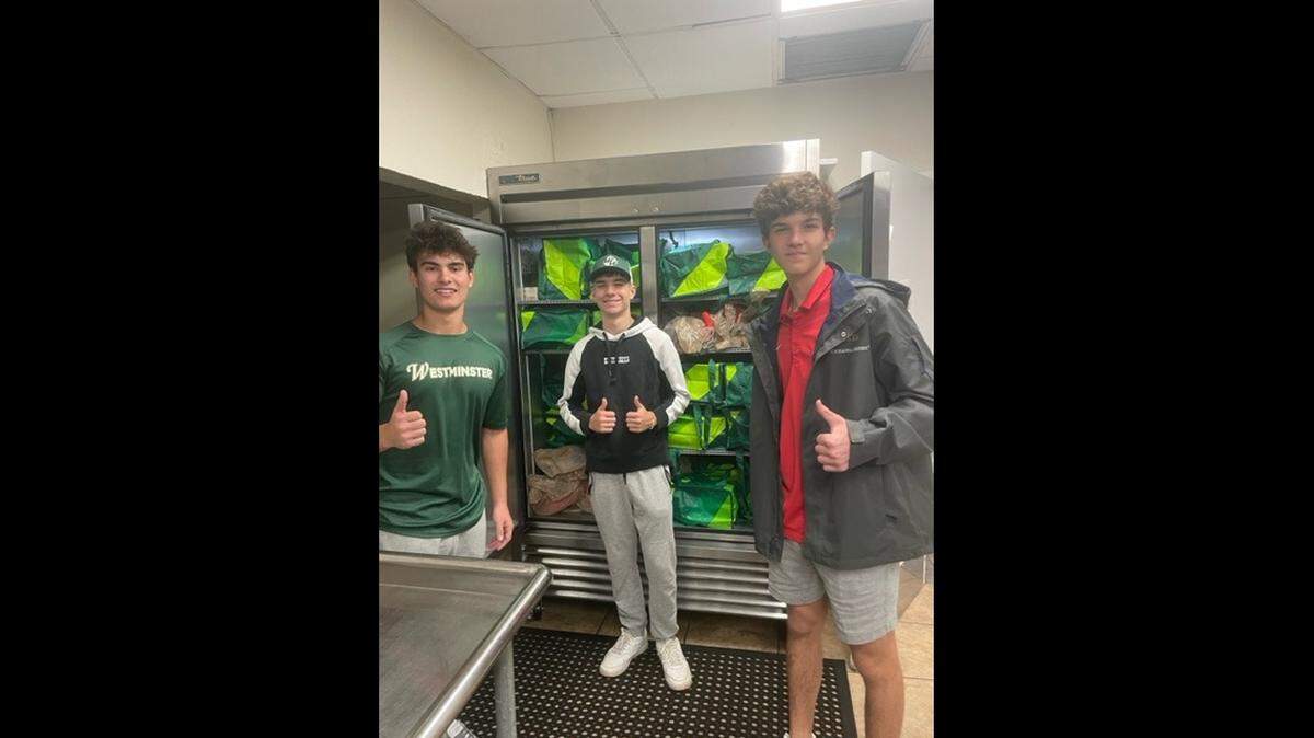 Cooking club students including Lucas Stefano, a senior at Westminster Christian School, Luke Malegni, a freshman at Westminster Christian School, and Massimo del Rio, a junior at Christopher Columbus High School, decided to make casseroles and deliver Thanksgiving meals to families affected by Hurricane Ian in Fort Myers. Publix provided the cooked turkeys.