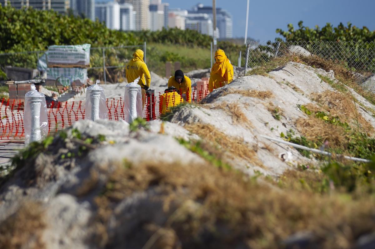 Some Miami Beach residents are concerned that a section of the beachwalk being built on the sand dunes between Third and Fifth streets could affect their ability to shield seaside buildings from storms and keep sand from washing away..