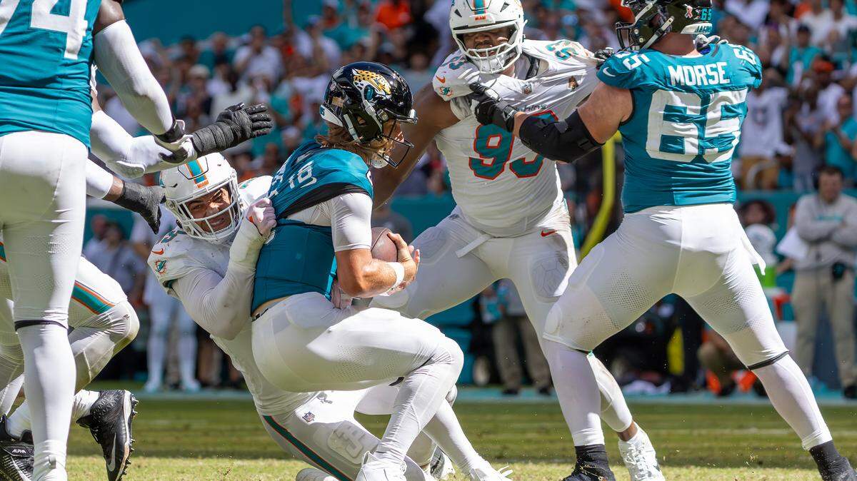 Miami Dolphins linebacker Jaelan Phillips (15) sacks Jacksonville Jaguars quarterback Trevor Lawrence (16) during the second half of an NFL football game against the Jacksonville Jaguars at Hard Rock Stadium on Sunday, Sep. 8, 2024, in Miami Gardens, Fl.