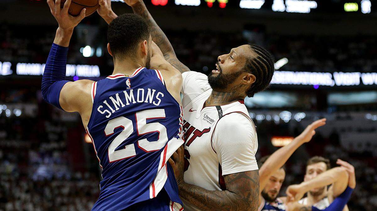 Heat forward James Johnson defends against Philadelphia's guard Ben Simmons in the in the fourth quarter of the playoff: round 1 game 4 between the Miami Heat and the Philadelphia 76ERS, at AmericanAirlines Arena in Miami on Saturday, April 21, 2018.
