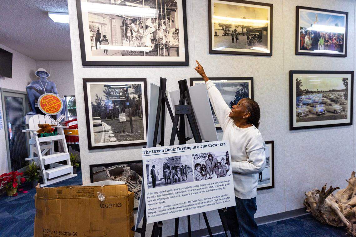 Anna Lightfoot-Ward, former mayor of El Portal, points to a 1956 photo of herself riding the carousel at Virginia Key Beach Park in Miami. She was one of several people in December who recounted going to the beach as children.