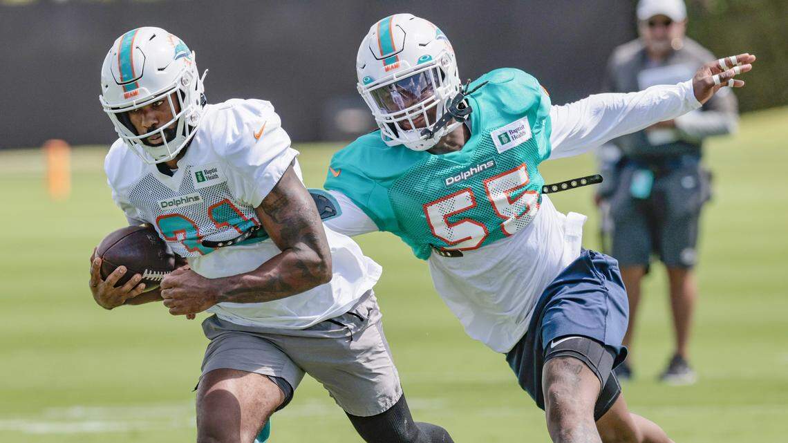 Miami Dolphins running back Raheem Mostert (31) runs the ball as linebacker Jerome Baker (55) gives chase during practice drills at Baptist Health Training Complex in Miami Gardens on Thursday, September 22, 2022.