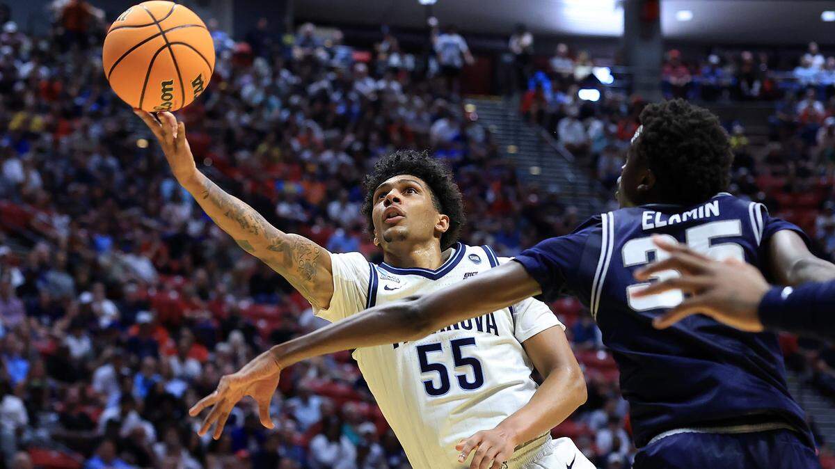 SAN DIEGO, CALIFORNIA - MARCH 20: Acaden Lewis #55 of the Villanova Wildcats shoots the ball against Adlan Elamin #35 of the Utah State Aggies during the first half in the first round of the 2026 NCAA Men's Basketball Tournament at Viejas Arena at San Diego State University on March 20, 2026 in San Diego, California. (Photo by Sean M. Haffey/Getty Images)