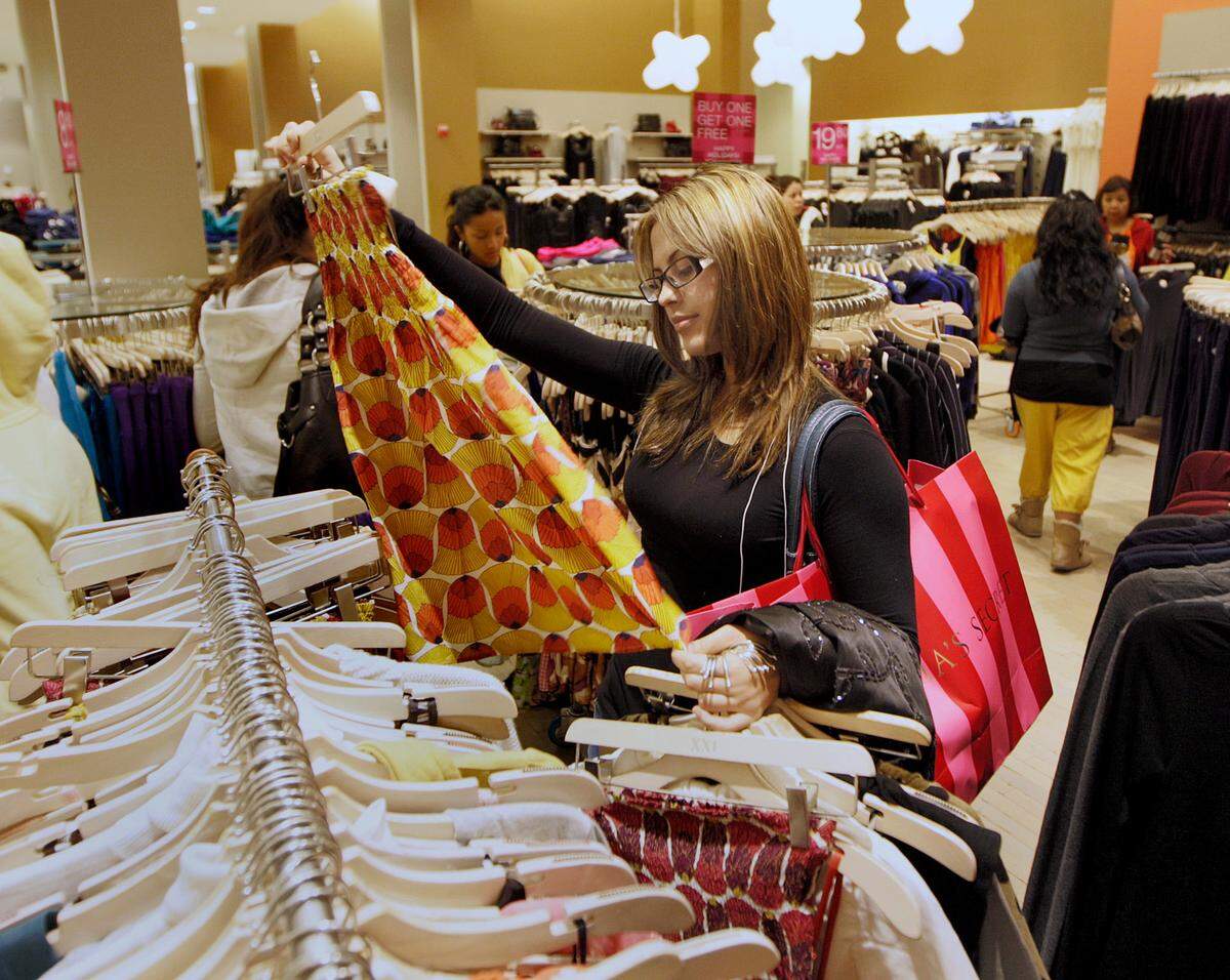 In this file photo from Nov. 28, 2008, then Miami Dade College student Dinez Garcia, then-20, shopped at Forever 21 in the Dolphin Mall on the Friday after Thanksgiving in West Miami.