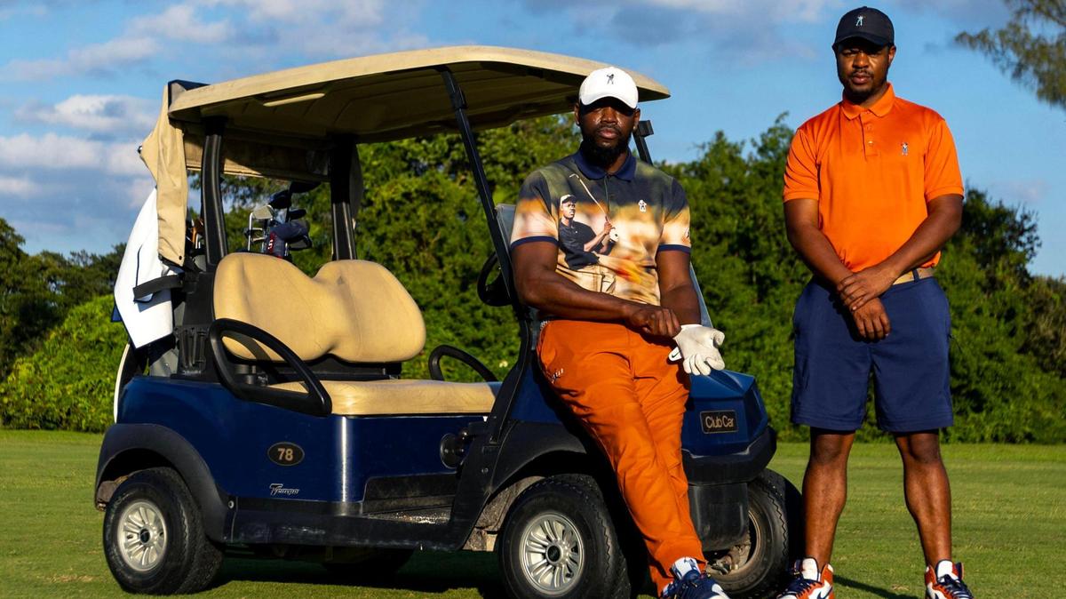Eastside Golf founder Olajuwon Ajanaku and co-founder Earl A. Cooper strike a pose at Miami Springs Golf & Country Club in Miami Springs, Florida, on Saturday, December 10, 2022. Eastside Golf is a lifestyle golf brand developed to raise awareness about golf among youth and non golfers.