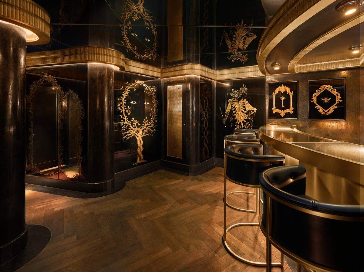 Another view of the black-and-bronze design of El Secreto, the latest restaurant at Faena Hotel Miami Beach.