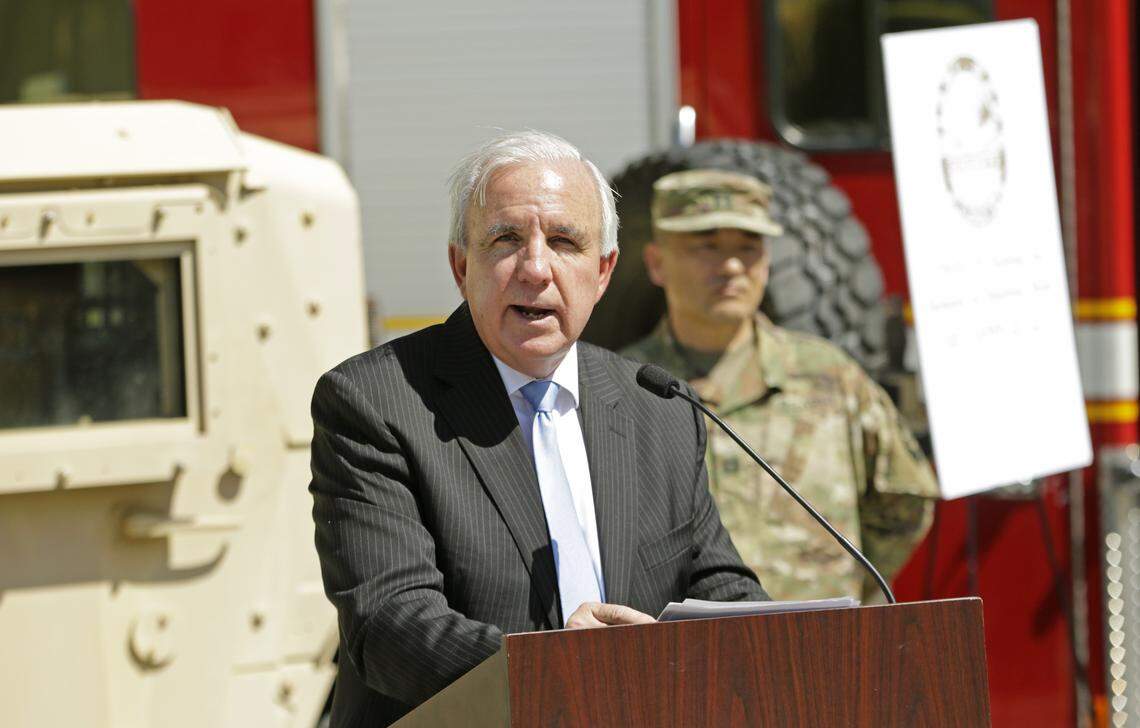 Miami-Dade County Mayor Carlos Gimenez speaks at a press conference at the COVID-19 drive-thru testing center at Marlins Park in Miami on Tuesday, March 24, 2020.