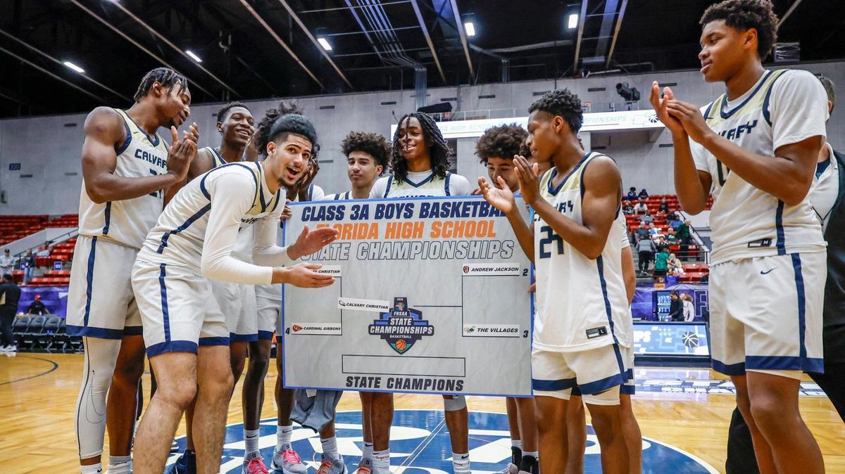 Calvary Christian Academy players celebrate after defeating Cardinal Gibbons during boys 3A basketball semifinal game of the Florida High School State Championships at the RP Funding Center in Lakeland, Florida on Friday, February 28, 2025.