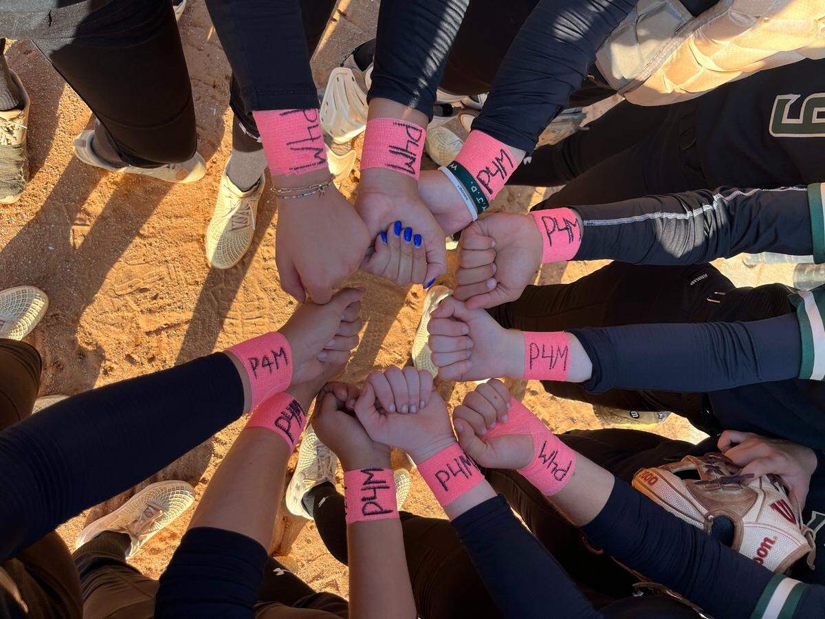 Westminster Christian’s softball players have been writing “P4M” – in shorthand that means Pray For Maya – on their pink wrist bands, and wearing them during games to honor Maya Kirk, the 10-year-old daughter of the school’s boys’ soccer coach, Josh Kirk, who this week lost a battle with brain cancer.