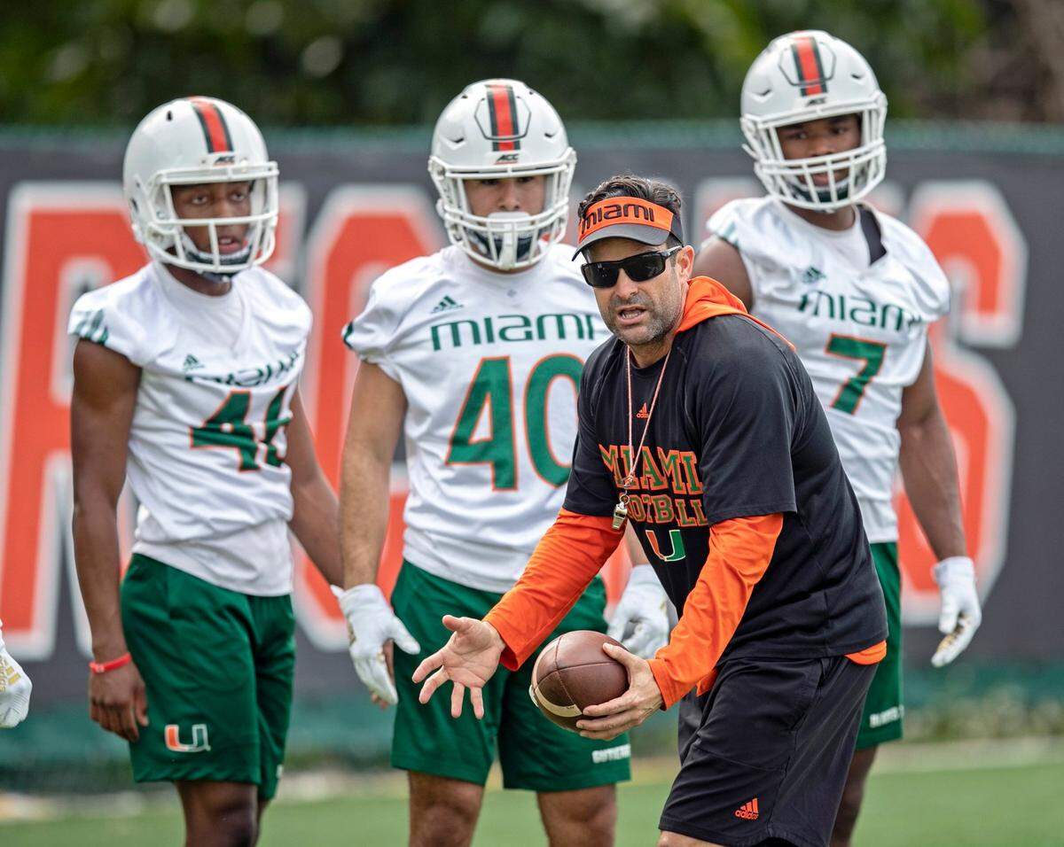 Miami Hurricanes coach Manny Diaz coaches players during practice at the University of Miami’s Greentree Field in Coral Gables on Tuesday, March 3, 2020.
