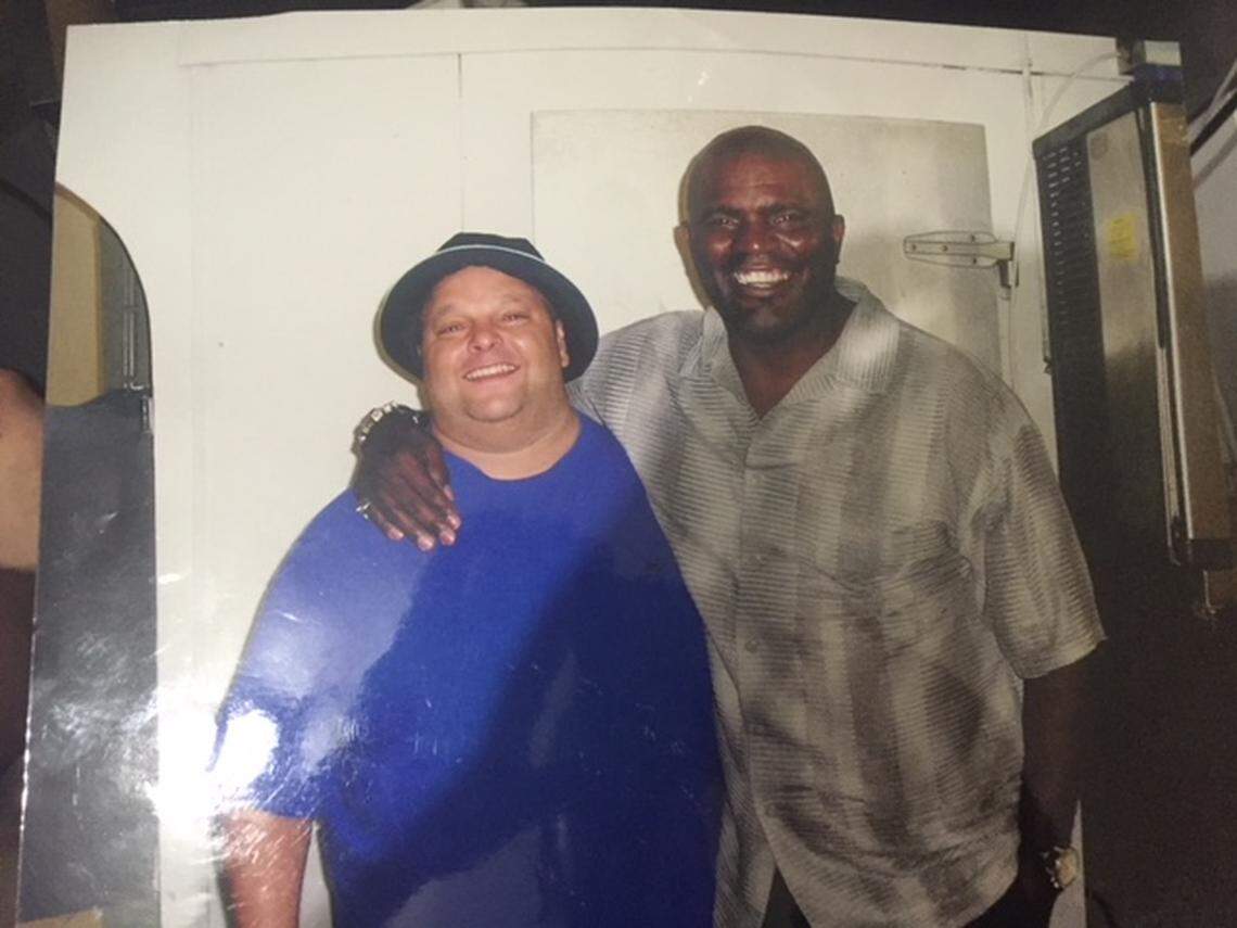 That's 'Fat Tony' Galeota, manager of the late strip club Porky's, with Lawrence Taylor, the legendary New York Giants linebacker.