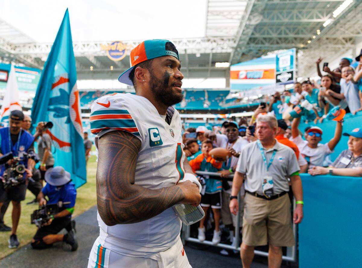 Miami Dolphins quarterback Tua Tagovailoa (1) walk off the field after the Dolphins 31-17 win over the New England Patriots during an NFL football game at Hard Rock Stadium on Sunday, Oct. 29, 2023 in Miami Gardens, Fl.