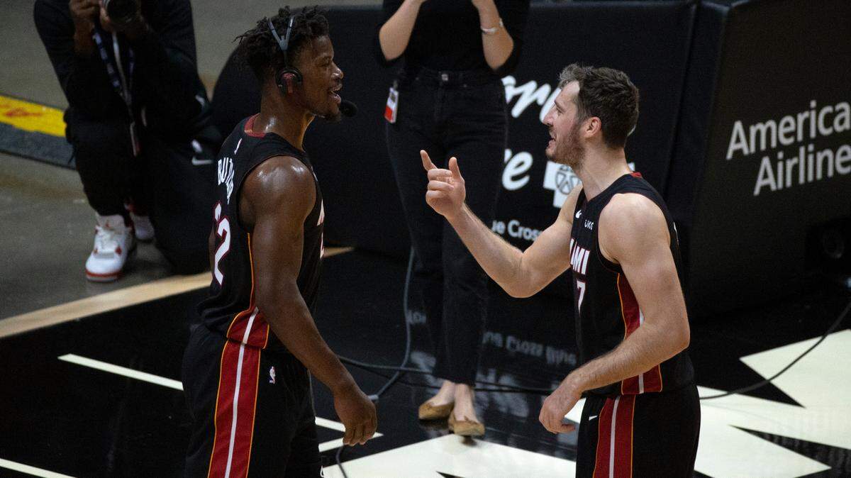 Miami Heat players Goran Dragic (7) and Jimmy Butler (22) talk after their 124-116 win over the Utah Jazz during an NBA basketball game at the AmericanAirlines Arena on Friday, February 26, 2021.