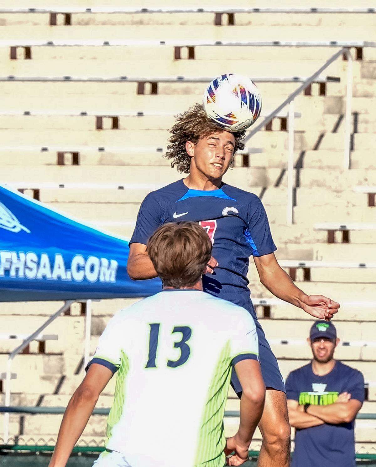 Columbus’ Jayden Glasper goes up for a header during Tuesday’s Class 7A state semifinal at SpecMartin Stadium in DeLand, Fla.