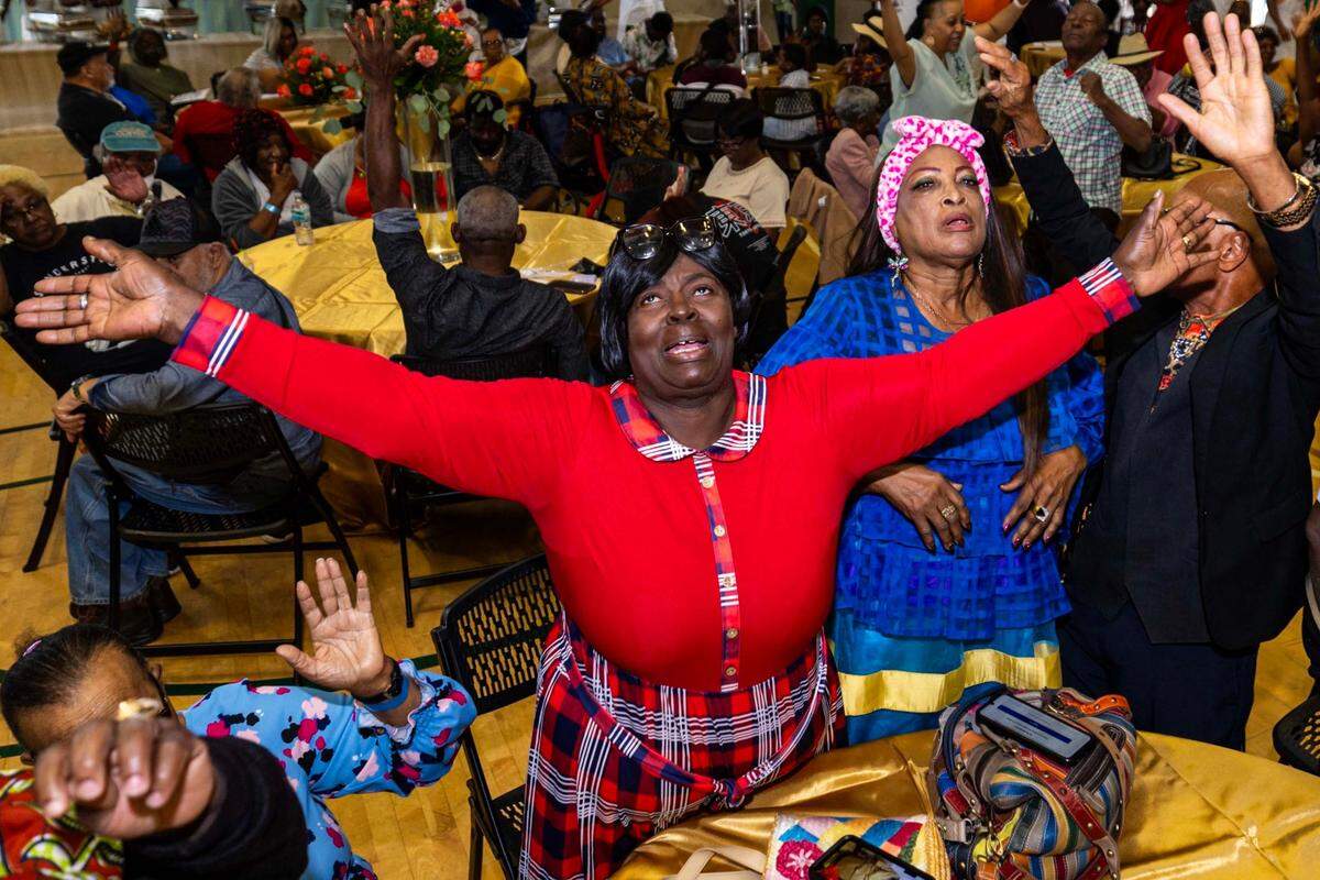 A woman reacts to a sermon during the 18th Annual Haitian Thanksgiving Brunch