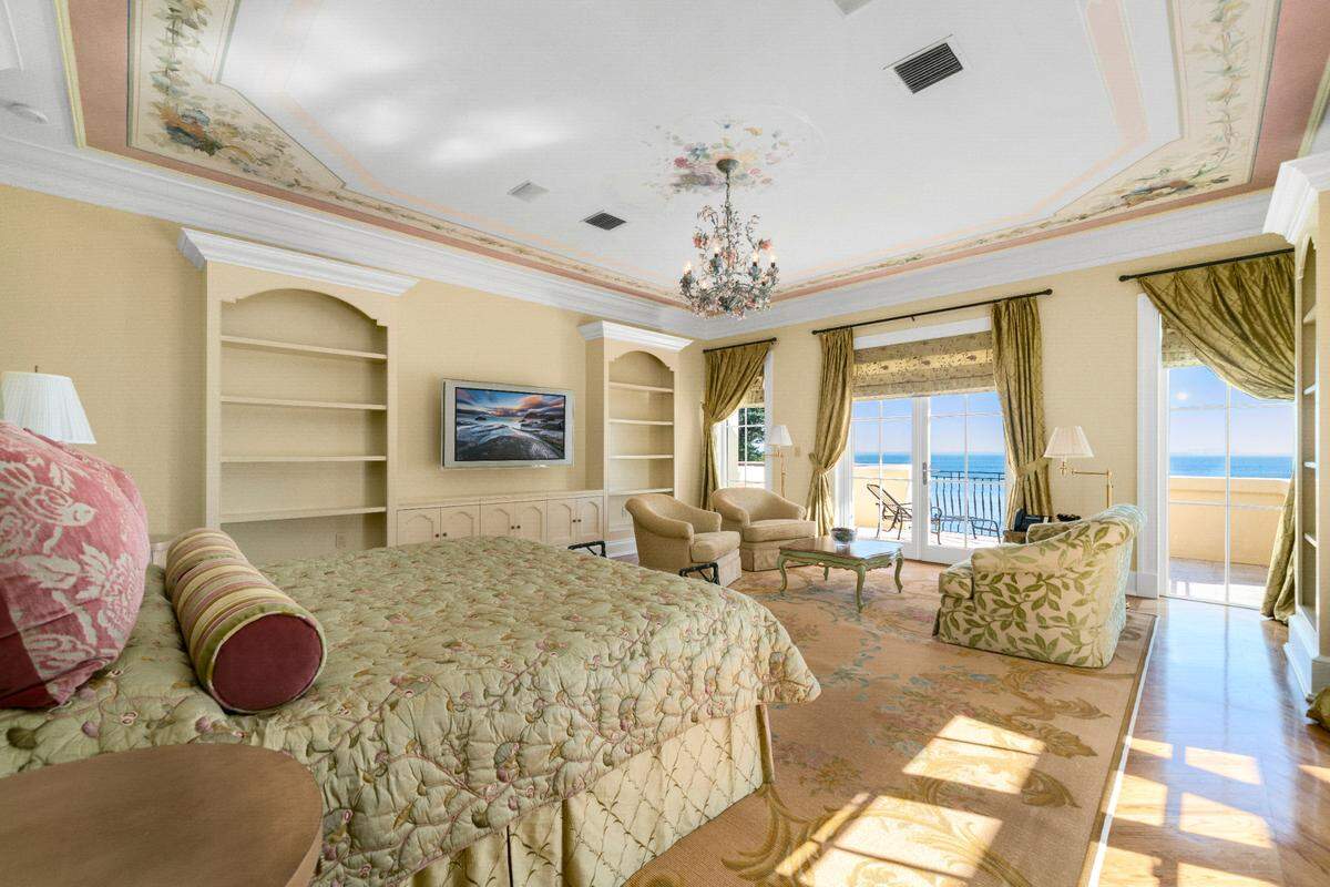 Built in 1999, Indian Spring covers nearly 13,000 square feet and has five bedrooms and five bathrooms. Above: One of the five suites with a private balcony overlooking the bay.